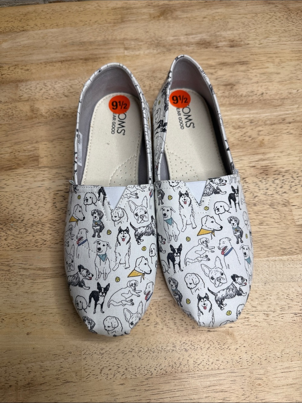 TOMS woman’s  Canvas Slip-Ons with Dog Print in White